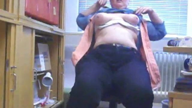 Office girl teases in her office